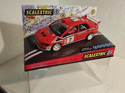 coche Scalextric Mitsubishi Lancer Evo7 WRC Rally Costa Brava 2002 escala 1:32  TecniToys 6090 Con luces 4x4 color rojo slot