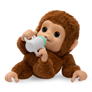 ¡Little Live Pet  Lil Baby Monkey!  aspecto y tacto realista de un bebé mono, también actúa como tal y tiene manos y pies que pueden agarrar, agarrar y abrazarse a objetos. Lil Baby Monkey también su boca es móvil y llama, habla y permite darle de comer. Con más de 50 sonidos y reacciones