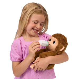 ¡Little Live Pet  Lil Baby Monkey!  aspecto y tacto realista de un bebé mono, también actúa como tal y tiene manos y pies que pueden agarrar, agarrar y abrazarse a objetos. Lil Baby Monkey también su boca es móvil y llama, habla y permite darle de comer. Con más de 50 sonidos y reacciones