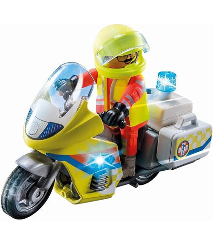 Moto de Emergencias - Playmobil Con la rápida moto de rescate con luz intermitente, el médico de urgencias llega al lugar del accidente para prestar ayuda. 