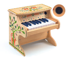 Cargar imagen en el visor de la galería, piano Animambo, Piano de madera bellamente pintada. Diseñado para animar a los niños a tocar música y crecer a amar los diversos sonidos . Tiene 18 teclas. Incluye partituras que enseñan a tocar las canciones mediante colores y formas básicas. Sistema intuitivo para introducir a los pequeños en la música. Estupendo sonido.